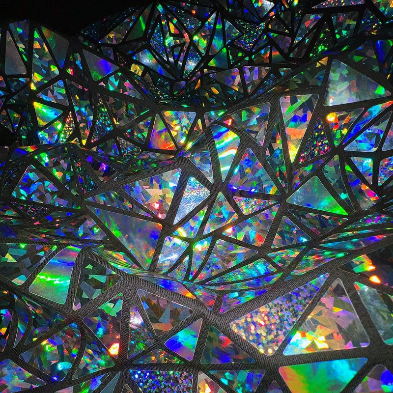 Holographic mosaic design on a Jason Brickhill garment with multicolored geometric panels.