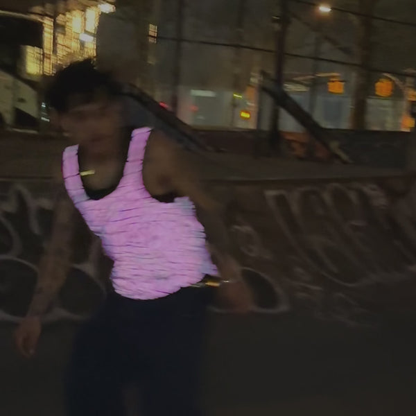 skateboarding in neon pink tank top